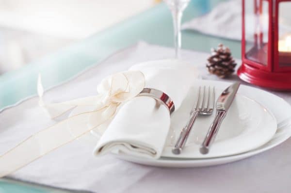 plate-with-cutlery-well-decorated-with-napkin-tied-with-golden-bow